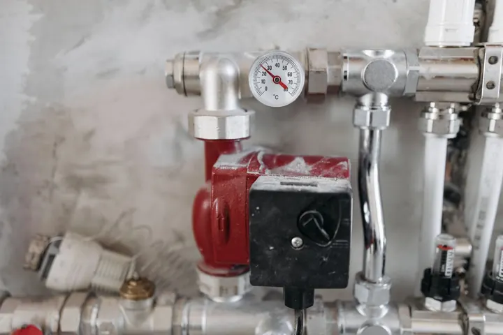 Pressure gauges and pipes on a hot water system, water heater installation Fort Myers